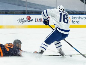 Blessed with a marathon runner's lungs, Toronto Masple Leafs star Mitch Marner has been averaging 23 minutes a game Here. he tries to evade diving Edmonton Oiler Darnell Nurse Jan. 28. (Ian Kucerak photo)
