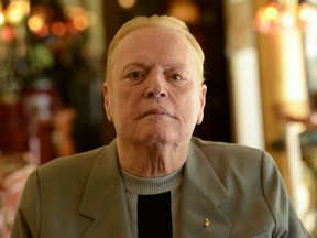 In this photo taken on June 11, 2014 publisher of Hustler magazine Larry Flynt poses at his house in Los Angeles. - US porn mogul Larry Flynt, best known as the publisher of Hustler Magazine and a self-styled free-speech champion, died in Los Angeles February 10, 2021, aged 78, according to media reports. Family members confirmed the death to the Washington Post and NBC but did not cite a specific cause. Celebrity outlet TMZ, which broke the news, said Flynt had died from heart failure. (Photo by Chris DELMAS / AFP) (Photo by CHRIS DELMAS/AFP via Getty Images)