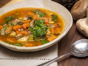 Spinach adds extra flavour and colour to mushroom barley soup, a meatless winter comfort dish. (Derek Ruttan/The London Free Press)