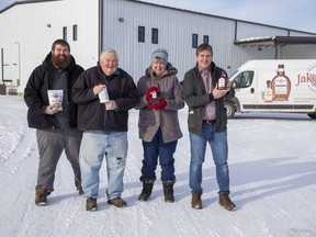 Devin, Robert, Mary and Chad Jakeman of Jakeman's Maple Products stand outside their new $3-million, 24,000-square-foot plant in Beachville where the company receives syrup from about 200 Ontario suppliers. The company landed a deal to get its products into 280 Loblaw stores in Ontario after the COVID-19 pandemic closed airport gift shops across Canada that were the company's largest source of sales. Derek Ruttan/The London Free Press/Postmedia Network