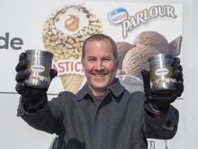 Nestle Canada Inc. factory manager Eric Berdan displays re-useable ice cream containers in London. (Derek Ruttan/The London Free Press)