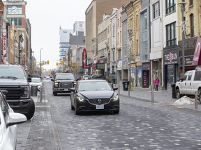 City hall is proposing a pilot project to add two bike lanes, one each way, and ban west-bound vehicular traffic on Dundas Place during the summer roadwork season ahead. (Derek Ruttan/The London Free Press)