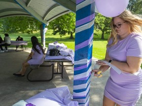 Ryley Cambridge of London tries to rewrap a pavilion post in Springbank Park in July 2020 for her friend's wedding reception. Couples planning to get married face more uncertainty in 2021 as COVID-19 restrictions could affect the number of people who can attend ceremonies and receptions, wedding planners say. (Mike Hensen/The London Free Press)