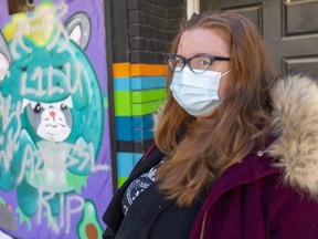 Kayla Gibbens, owner of Uber Cool Stuff on Dundas Street, says anti-Semitic graffiti defacing this downtown mural will be painted over and the original artist, Brad Biederman, invited to create another mural. (Mike Hensen/The London Free Press)