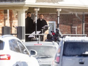 Pastor Henry Hildebrandt, right, preaches Sunday at a drive-in service at the Church of God in Aylmer. Hildebrandt said church members were staying in their vehicles as a goodwill gesture to the provincial government. The Ministry of the Attorney General obtained an interim court order Friday night requiring the church to comply with emergency laws limiting indoor and outdoor religious services to a maximum of 10 people. Mike Hensen/The London Free Press