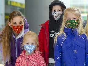 The Van De Hoef clan from Strathroy was rocking a whole variety of masks Friday in White Oaks Mall. From left are Emma, 11, Abbie, 4, Ethan, 11, Autumn, 7, and Jordyn, 13. (Mike Hensen/The London Free Press)