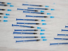 Syringes filled with the Pfizer-BioNTech vaccine against the coronavirus disease (COVID-19) are seen during a mass vaccination rollout in Ronda, Spain February 11, 2021. REUTERS/Jon Nazca ORG XMIT: GGG-JN69