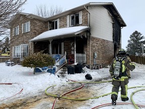 A semi-detached home on Borden Street in Stratford suffered “extremely extensive” damage in a fire Tuesday morning. There men were taken to hospital as a precaution. Cory Smith/Postmedia News