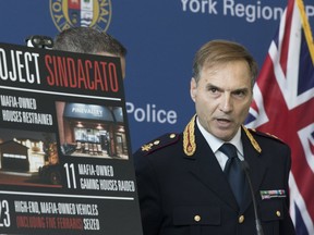 Fausto Lamparelli, of the Italian State Police, Traditional Organized Crime Task Force, speaks to media as York Regional Police held a news conference detailing charges laid in Project Sindacato on Thursday, July 18, 2019. (Stan Behal/Toronto Sun/Postmedia Network)