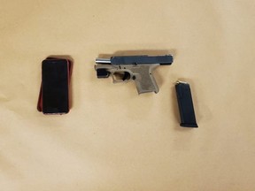London police seized a loaded P80 semi-automatic nine-millimetre handgun, a prohibited magazine and 15 rounds of ammunition following the arrest of two people. Officers were investigating a complaint from a couple who say the driver of SUV that pulled up alongside them Saturday on Adelaide Street had a firearm. (London police)