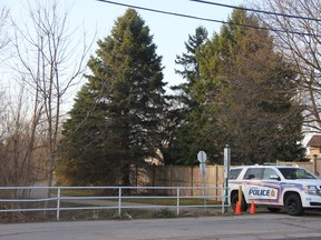 A London police cruiser on Thursday morning was blocking access to a path north of Barker and Huron streets, where police said officers responded the night before to reports of a shooting. The path connects Kipps Lane and Barker Street and backs several single-family homes. JONATHAN JUHA/The London Free Press