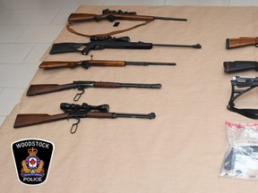 A 31-year-old Woodstock man faces weapons and drug charges after Woodstock police seized drugs and 10 real and replica guns following the discovery of parts of a motorcycle reported stolen in Sarnia last year. (Supplied)