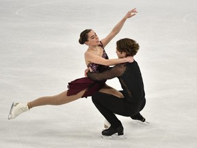 Londoner Evelyn Walsh and Trennt Michaud of Belleville are shown here in action during the pairs free skating final at the world figure skating championships. (TT News Agency via REUTERS/Anders Wiklund)