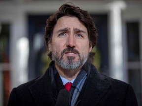 (FILES) In this file photo taken on December 18, 2020 Canadian Prime Minister Justin Trudeau speaks during a Covid-19 briefing at the Rideau Cottage in Ottawa, Ontario. - Prime Minister Justin Trudeau on March 15, 2021 urged Canadians to take the AstraZeneca vaccine, in response to reports of hesitancy after several nations halted its rollout over fears of blood clots and other side effects.

"Our experts and scientists have spent an awful lot of time making sure that every vaccine approved in Canada is both safe and effective," Trudeau told a news conference in Montreal, where he toured a Covid-19 vaccination centre. (Photo by Lars Hagberg / AFP) (Photo by LARS HAGBERG/AFP via Getty Images)