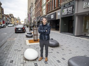 Izaac Whitehead, manager of Soul Kitchen on Dundas Street in downtown London, said a bylaw enforcement officer was handing out tickets to delivery drivers stopped for pickup on a recent busy night for the restaurant. (Derek Ruttan/The London Free Press)