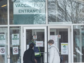 People enter the COVID-19 vaccination clinic at  the Caradoc Community Centre in Mt. Brydges, Ont. on Thursday March 18, 2021. (Derek Ruttan/The London Free Press)