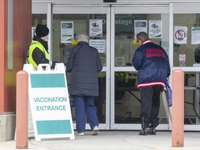 People enter the COVID-19 vaccination clinic at  the North London Optimist community centre in London on Thursday March 18, 2021. (Derek Ruttan/The London Free Press)