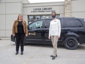 Lori Chouinard, president of Star Taxi, and Leigh Robinson, branch supervisor of the Lucan Public Library, helped launch a pilot project that offers free taxi rides to Middlesex County young people so they can access mental health services in London. (Derek Ruttan/The London Free Press)