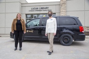 Lori Chouinard, president of Star Taxi, and Leigh Robinson, branch supervisor of the Lucan Public Library, helped launch a pilot project that offers free taxi rides to Middlesex County young people so they can access mental health services in London. (Derek Ruttan/The London Free Press)