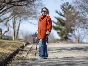 Meredith Levine, who has balance and mobility challenges, opposes the proposed addition of a sidewalk on Abbey Rise in the Sherwood Forest neighbourhood.
 (Derek Ruttan/The London Free Press)