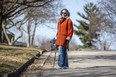 Meredith Levine, who has balance and mobility challenges, opposes the proposed addition of a sidewalk on Abbey Rise in the Sherwood Forest neighbourhood.
 (Derek Ruttan/The London Free Press)