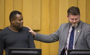 Ward 4 councillor Jesse Helmer rests his hand on Ward 3 councillor Mo Salih's shoulder after Salih delivered an impassioned speech calling for an end to the London Police Service's practice of carding during a meeting at city hall in London on Tuesday November 22, 2016. The two councillors said Wednesday they will not seek re-election in 2022. (Free Press file photo)