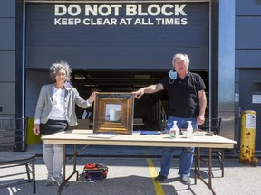 Brian Meehan, right, CEO of Museum London, has announced he will be retiring next year. Among the projects he has been involved with is the annual UPwithART, which in 2020 raised $150,000 for the museum and the Unity Project for Relief of Homelessness, represented by Silvia Langer, development director. (Mike Hensen/The London Free Press)