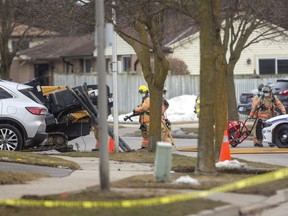 London firefighters monitor conditions on Carlyle Drive in east London after five homes were evacuated at about 4 p.m. following a natural gas leak caused when a crew drilling underground struck a line. Residents were allowed back into their homes at about 5:45 p.m. after Enbridge Gas workers shut off the gas. Mike Hensen/The London Free Press/Postmedia Network