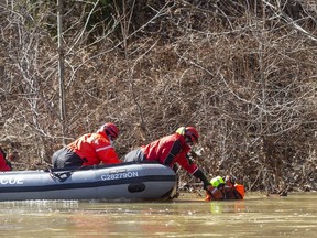 London firefighters pulled a dummy from the waters as they practised their rescue skills on the Thames River near Wonderland Gardens. Photo taken on Sunday March 15, 2021. Mike Hensen/The London Free Press