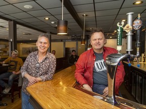 Tom Imeson and Jeff Rowe are the owners of the Fireside Grill and Bar on Commissioners Road East in London. They hope to be able to hold 60 to 70 customers inside at once due to a relaxation of COVID-19 restrictions. Mike Hensen/The London Free Press
