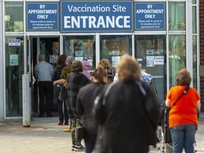 Londoners were lining up at the COVID-19 vaccination centre at the Western Fair Agriplex in London on Wednesday March 24, 2021. (Mike Hensen/The London Free Press)