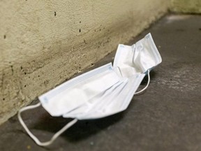 A discarded medical mask has become a common thing to see in London during the COVID-19 pandemic.  (Mike Hensen/The London Free Press)