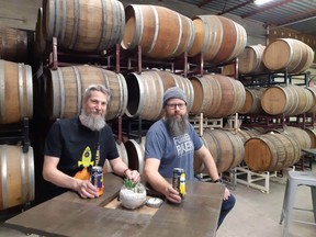 Andrew Peters and Dave Reed have dedicated an entire wall to barrel-aged beers at Forked River. (Wayne Newton photo)