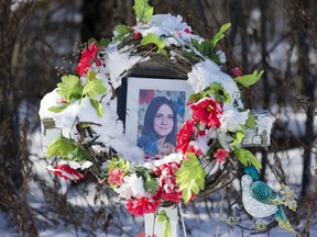 A photo of Karen Caughlin is framed by wreath in this 2017 photo of a memorial set up on Plowing Match Road in Lambton County where her body was found in 1974. Lambton OPP investigators are appealing for tips as they to continue to investigate the death of the 14-year-old.
