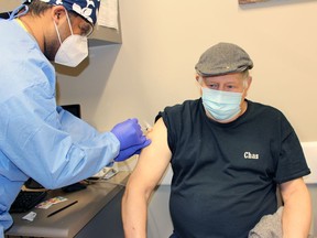 Sarnia-area resident Chas Bunda, 75, gets a shot of Moderna COVID-19 vaccine from Dr. Justin Mall at the Central Lambton Family Health Team in Petrolia on Monday, March 22. (Terry Bridge/Postmedia Network)