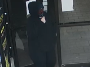 Police are looking for a  woman, about five-foot-six and 180 pounds, after a convenience store at Belmont Drive and Wharncliffe Road South was robbed at knifepoint Thursday morning.(London Police photo)