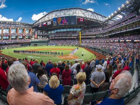 A view of the field and the fans and the ballpark and the players during the playing of US and Canadian national anthems before the game between the Texas Rangers and the Toronto Blue Jays at Globe Life Field. Mandatory Credit: Jerome Miron-USA TODAY Sports