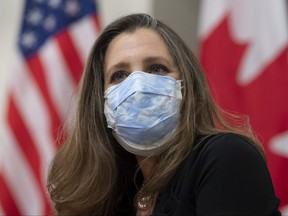 Deputy Prime Minister and Minister of Finance Chrystia Freeland looks on as she participates in a meetings with Prime Minister Justin Trudeau and virtually with United States President Joe Biden on Parliament Hill in Ottawa, Tuesday Feb. 23, 2021.