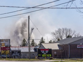 Smoke rises from a fire at John Zubick Ltd., a scrap metal yard at 105 Clarke Rd. in London on Friday April 2, 2021. Derek Ruttan/The London Free Press/Postmedia Network