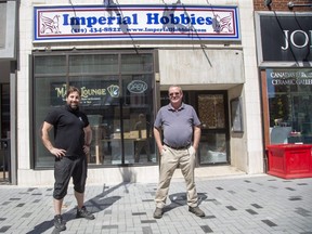 Jeff Evans, left, took over the site of Imperial Hobbies on Dundas Street from owner Dave Carney earlier this year. Evans' Tiny Titan mobile game development business, which took over the two floors above the shop, has been sold to Danish firm Trophy Games Development. (Derek Ruttan/The London Free Press)
