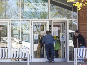 People enter the COVID-19 vaccination clinic at the Caradoc Community Centre in Mt. Brydges, Ont. in London, Ont. on Wednesday April 14, 2021. (Derek Ruttan/The London Free Press)