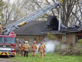 London firefighters brought this "total loss fire" at a vacant home at 1310 Adelaide St. N. under control about 6:30 a.m. Tuesday. Crews were still dousing hot spots later in the morning. City police say they deem the fire suspicious. (Derek Ruttan/The London Free Press)