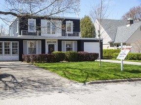This house at 1119 The Parkway was listed for sale for $800,000 but sold for $1.4 million, 75 per cent more than the asking price. Its prime riverfront location contributed to the bidding war, realtors said.  (Derek Ruttan/The London Free Press)