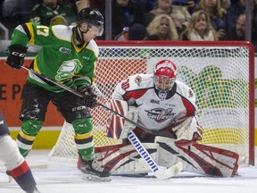 Nathan Dunkley of the Knights squares up to bunt, but can't get the deflection past Xavier Medina of the Windsor Spitfires during their game at Budweiser Gardens in London, Ont.  on Friday January 31, 2020.  (Mike Hensen/The London Free Press file photo)