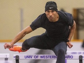 Decathlete Damian Warner practises hurdles at Farquharson Arena in April 2021. The challenge of training for the Tokyo Olympics in a hockey rink was one of the topics Warner talked about Monday in live virtual session with students of the Thames Valley District school board. He was joined by Gar Leyshon, a teacher who began coaching Warner at Montcalm. (Mike Hensen/The London Free Press)