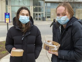 Best friends Julia Deck and Ainsleigh Wedow, who grew up in Mitchell are now living in residence at Western University, have to make decisions when they will move home. Western is urging students to move out as soon as they can because of a spike in COVID-19 cases on campus. Deck said there's "not really any reason I should stay," noting that classes and exams are going online. Wedow said she was going to make the decision this weekend after going home to her family. Photograph taken on Thursday April 1, 2021.  (Mike Hensen/The London Free Press)