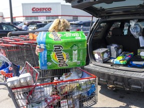 Dorothy Thompson loads up Wednesday, April 7, 2021, with about "two to three weeks" of goods and patio items for the summer at Costco on Wellington Road near Highway 401. (Mike Hensen/The London Free Press) (Mike Hensen/The London Free Press)