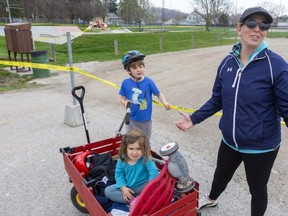 A frustrated Rebecca Rickwood of Port Stanley brought her kids to the local skatepark Sunday hoping son Rhys, 5, could practise on his new scooter and daughter Rylee, 2, could burn off some energy. "Maybe they don't work on Sunday," she said. "First, they close (playgrounds) then they open them, it's very frustrating because my kids still have all their energy." (Mike Hensen/The London Free Press)