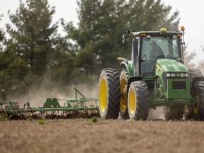 Terry Vanderwal of Middlesex County gets out the cultivator on a small field, with plans for planting corn, just north of the community of Coldstream. (Mike Hensen/The London Free Press)