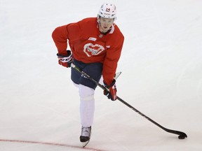 Washington Capitals center Connor McMichael (24) prepares to shoot the puck during an NHL workout at MedStar Capitals Iceplex. Mandatory Credit: Geoff Burke-USA TODAY